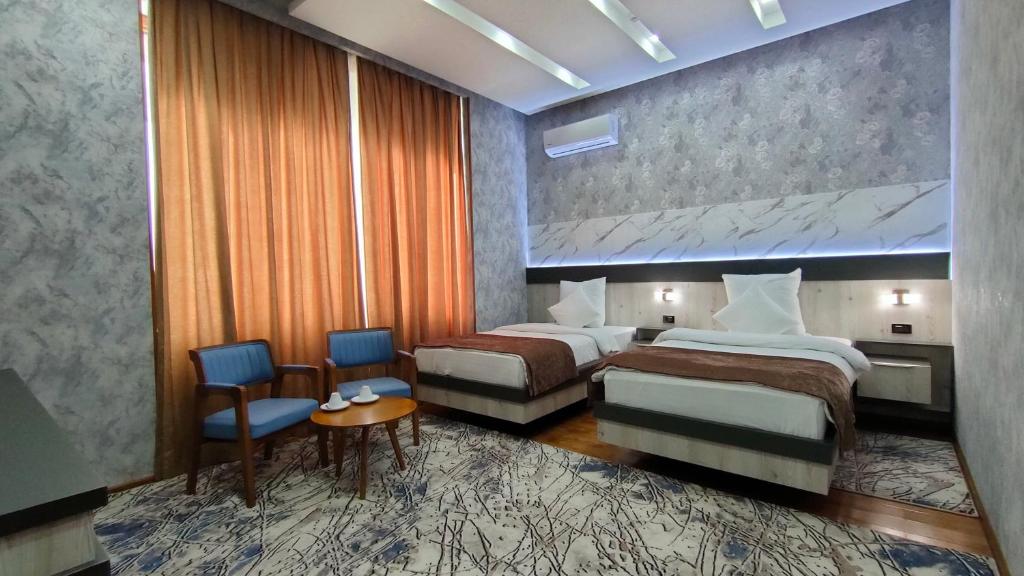 Postel nebo postele na pokoji v ubytování Ada Hotel