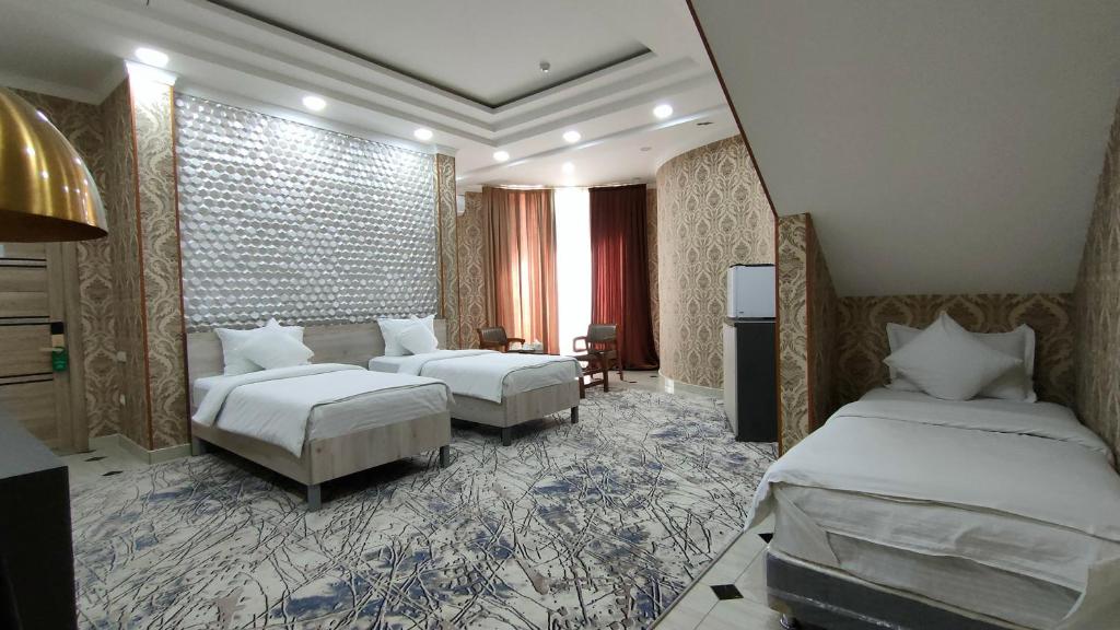 Postel nebo postele na pokoji v ubytování Ada Hotel