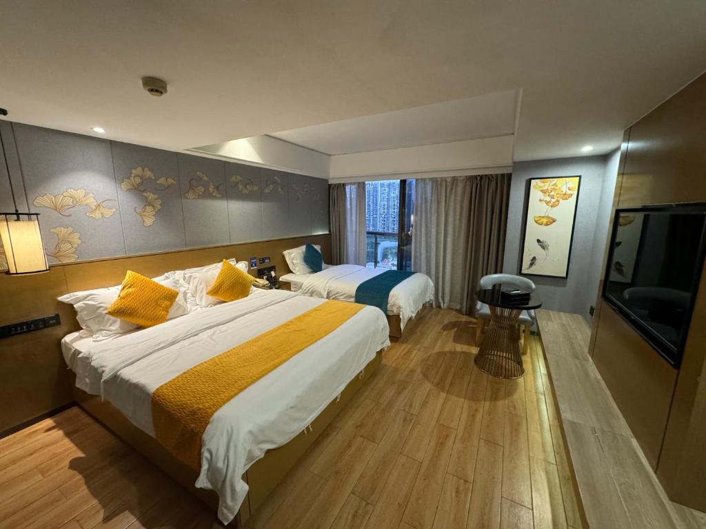 Postel nebo postele na pokoji v ubytování Orange Tree International Hotel Zhujiang New Town Huacheng Sqaure Branch - Free Shuttle Bus to Canton Fair Complex During Canton Fair Period