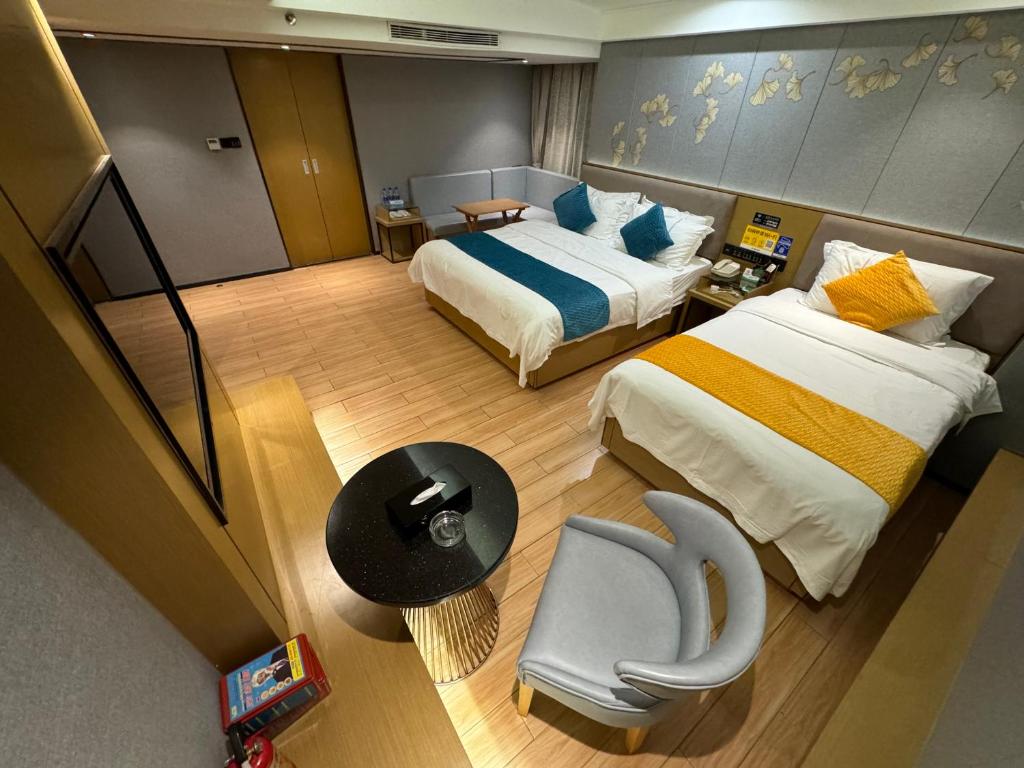 Postel nebo postele na pokoji v ubytování Orange Tree International Hotel Zhujiang New Town Huacheng Sqaure Branch - Free Shuttle Bus to Canton Fair Complex During Canton Fair Period