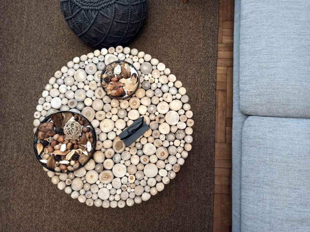 a circle of balls on the floor next to a couch at Kallaris Deluxe House in Thessaloniki