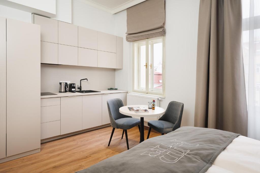 Postel nebo postele na pokoji v ubytování NOBILIS RESIDENCE