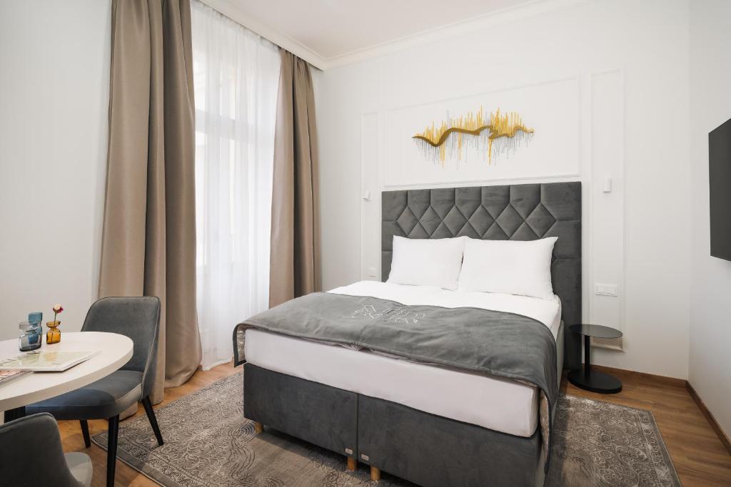 Postel nebo postele na pokoji v ubytování NOBILIS RESIDENCE
