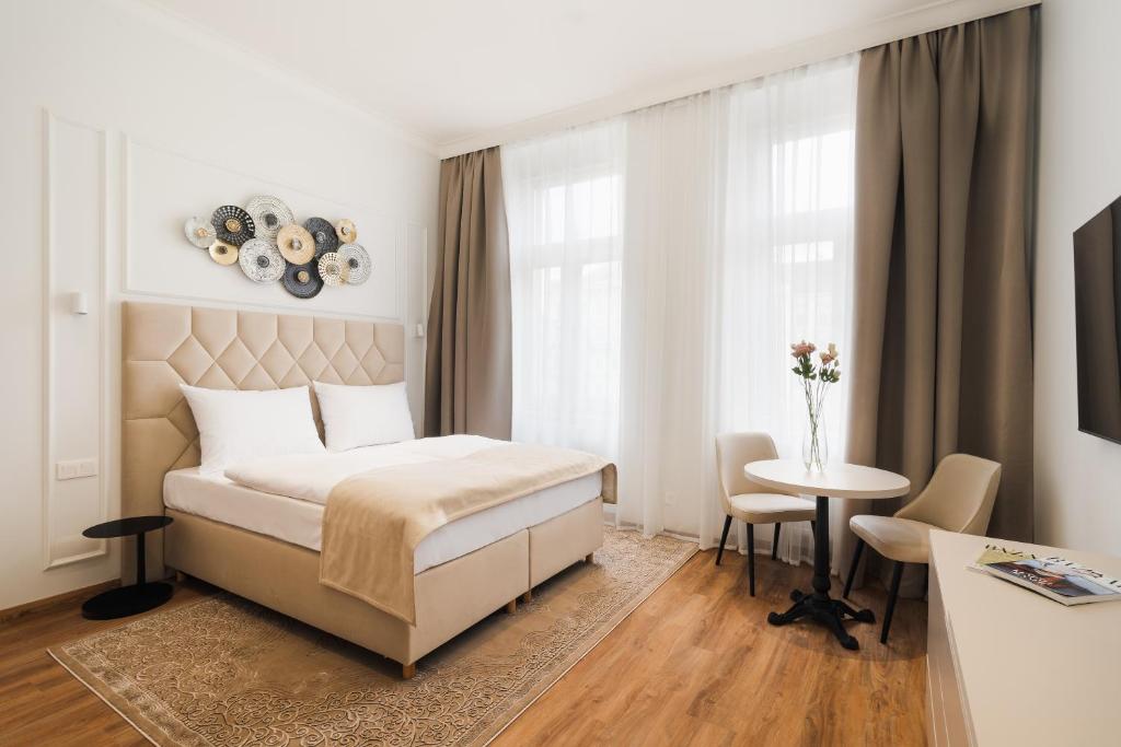 Postel nebo postele na pokoji v ubytování NOBILIS RESIDENCE