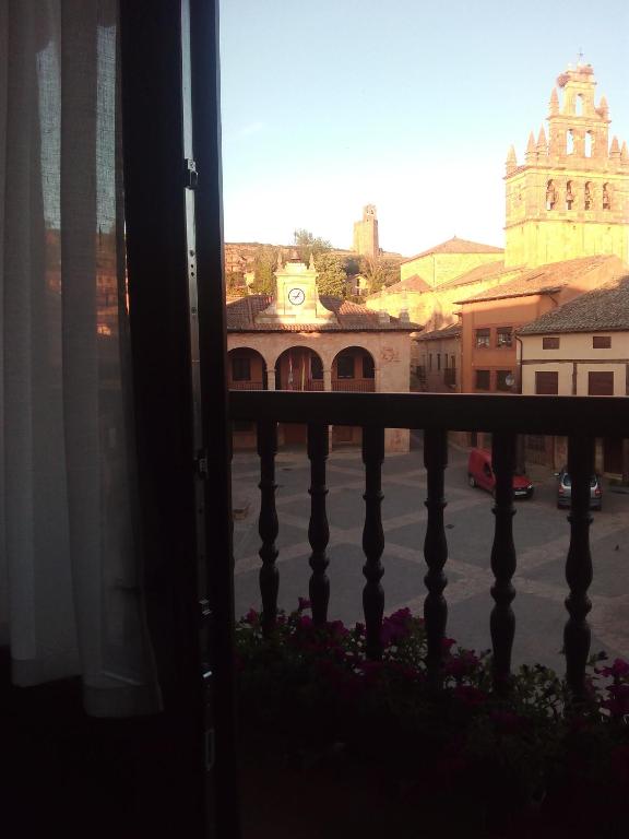 a view of a city from a balcony at Apartamentos La Alborada Medieval in Ayllón