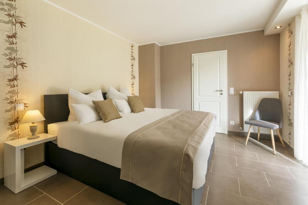 Postel nebo postele na pokoji v ubytování MEMORY - Ferienapartments & Zimmer - Mediterraner Flair in der Rhön