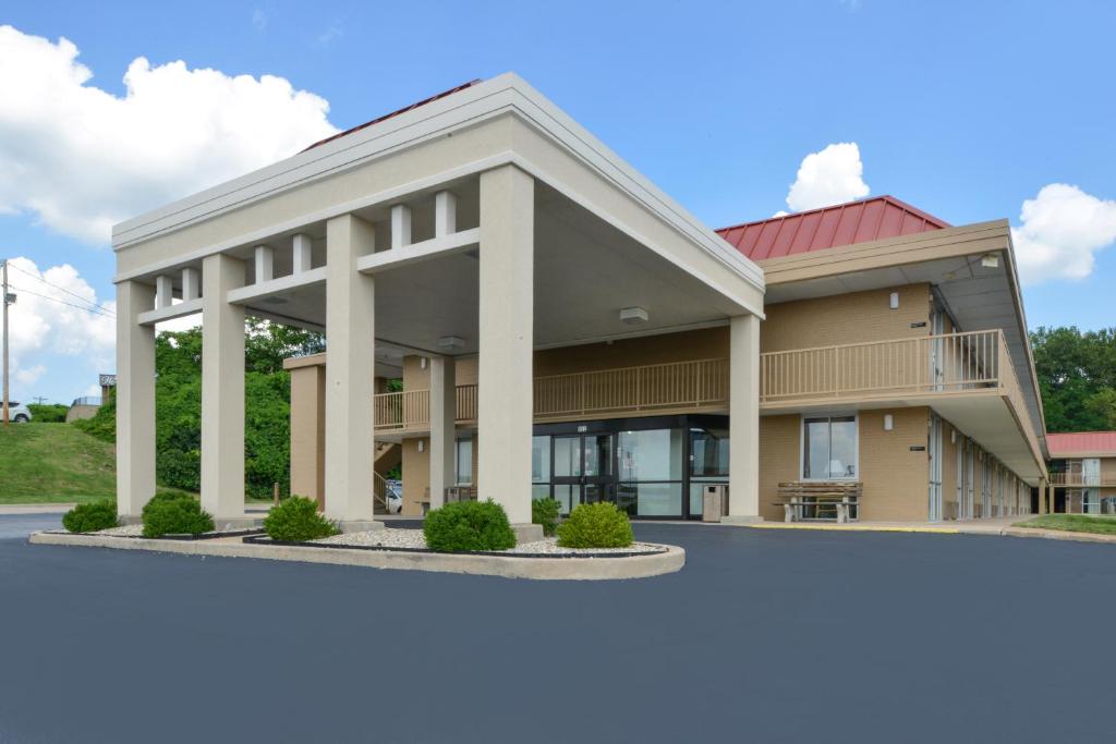 a large building with a red roof at Americas Best Value Inn - Collinsville / St. Louis in Collinsville