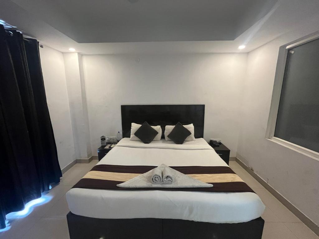 Llit o llits en una habitació de TIPSYY INN 007