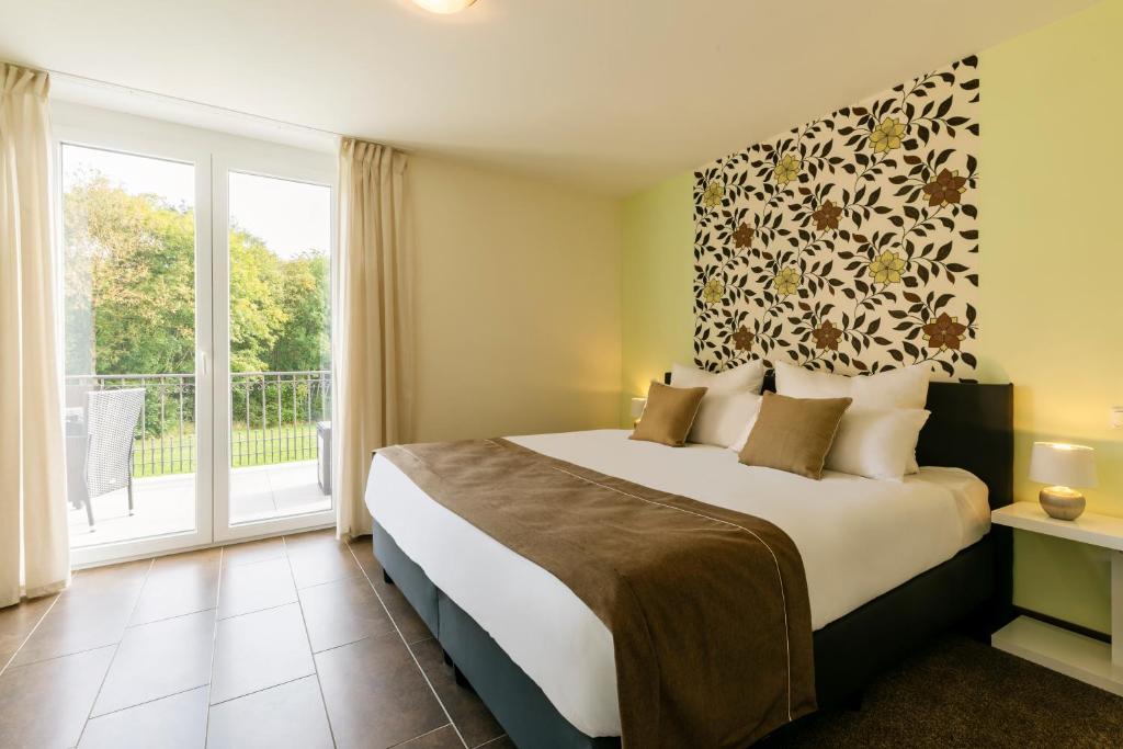 Postel nebo postele na pokoji v ubytování MEMORY - Ferienapartments & Zimmer - Mediterraner Flair in der Rhön