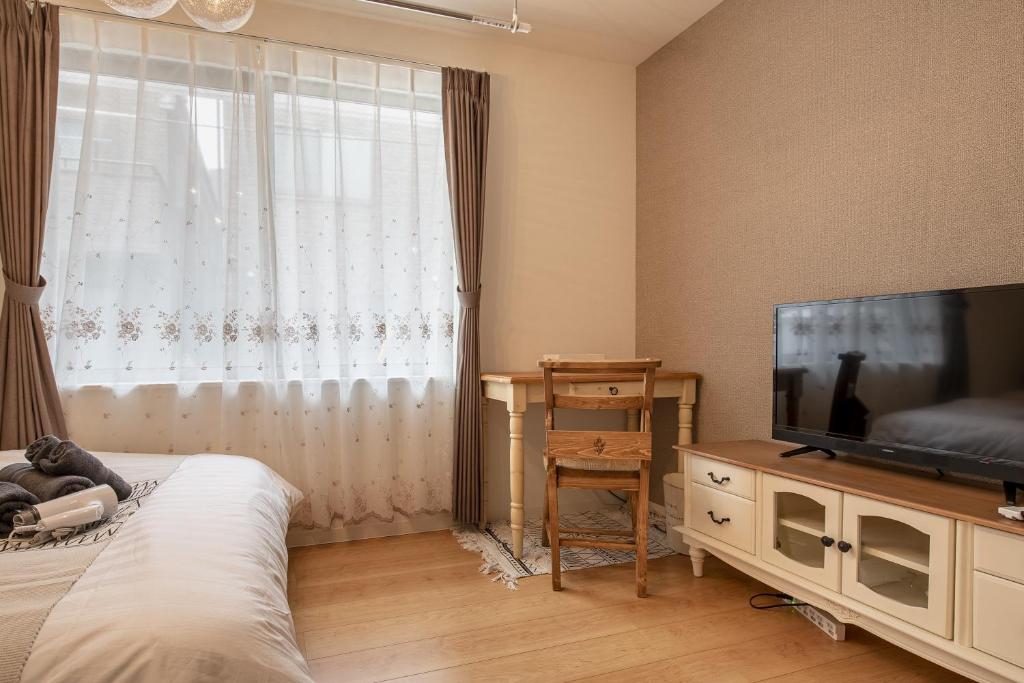 TV a/nebo společenská místnost v ubytování Felice Nishi-Shinjuku