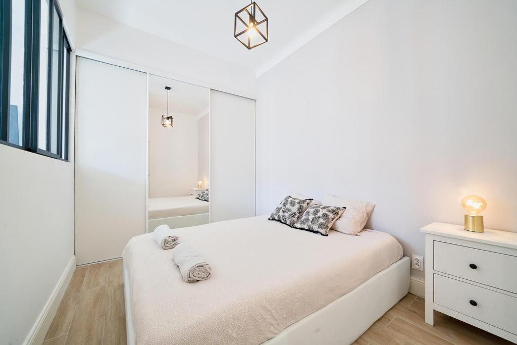 Postel nebo postele na pokoji v ubytování Palais Biagini - Happy Rentals