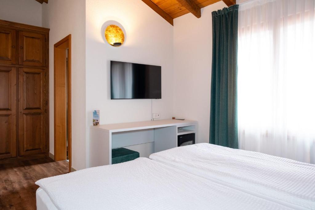 Postel nebo postele na pokoji v ubytování Hotel Il Castagno