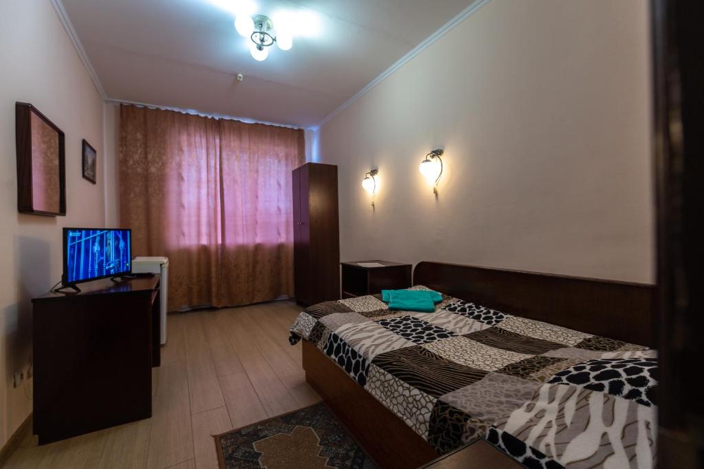 Postel nebo postele na pokoji v ubytování Алексік