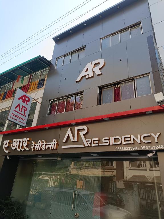a building with an ar agency sign on it at AR Residency in Mumbai