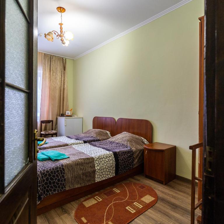 Postel nebo postele na pokoji v ubytování Алексік