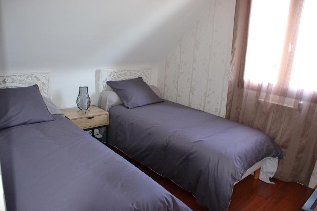 Postel nebo postele na pokoji v ubytování L' ESCALE SINAGOTE Chambre d'hôtes