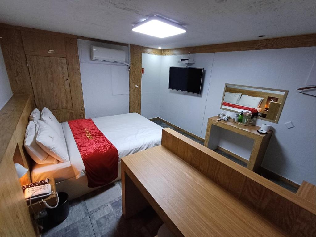 Postel nebo postele na pokoji v ubytování Residence Yeoyu
