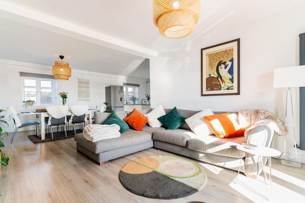 a living room with a couch and a table at Stunning Ground Floor Hartlepool Marina Apartment in Hartlepool
