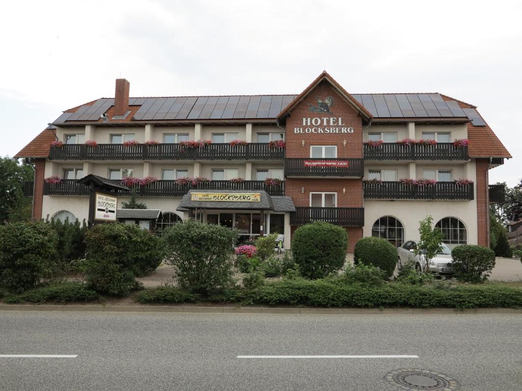 a hotel with a sign that reads hotel headquarters at Hotel Blocksberg in Wernigerode