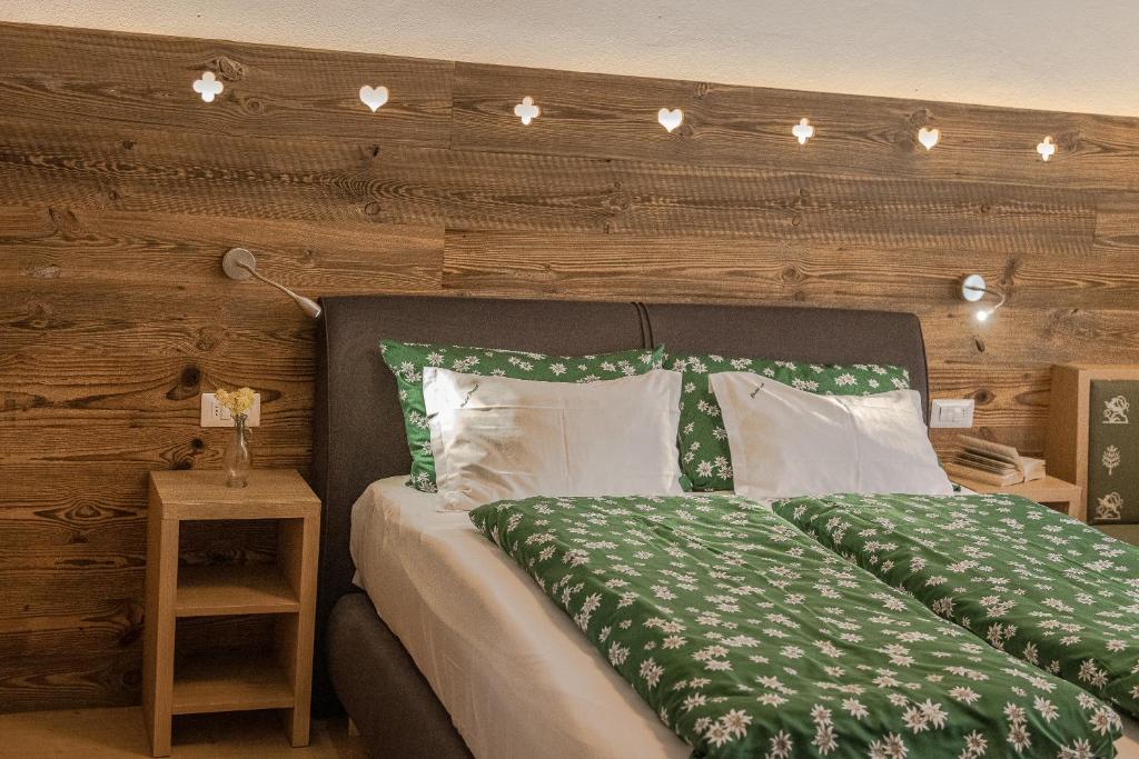 Voodi või voodid majutusasutuse Chalet Pradat toas