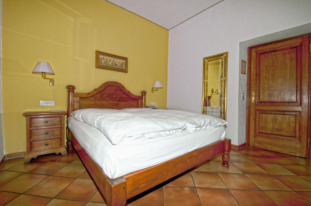 Postel nebo postele na pokoji v ubytování Albergo Ristorante della Posta