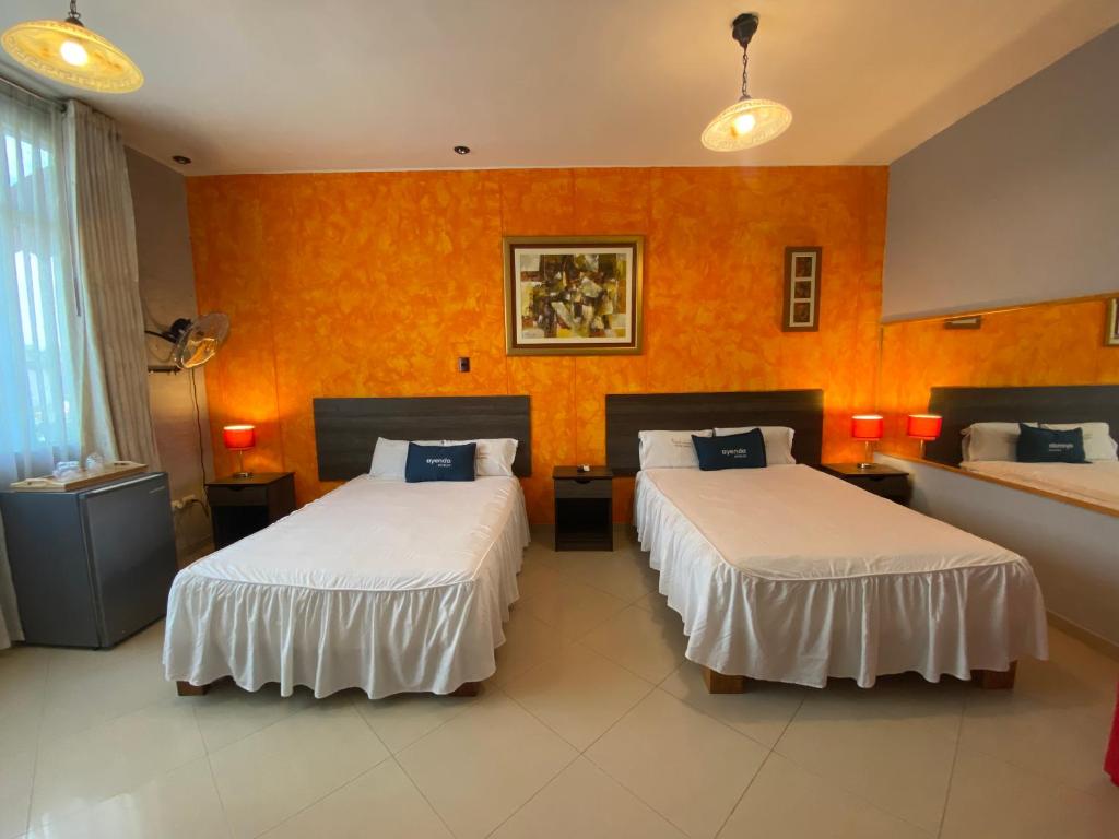 Ένα ή περισσότερα κρεβάτια σε δωμάτιο στο Suite Apart Miraflores
