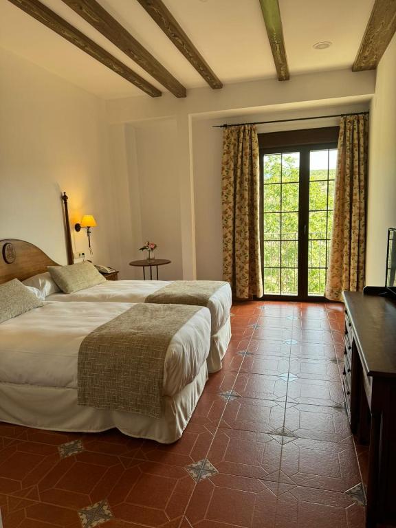 Postel nebo postele na pokoji v ubytování Hotel Rural Cazorla Posada del Cordobés