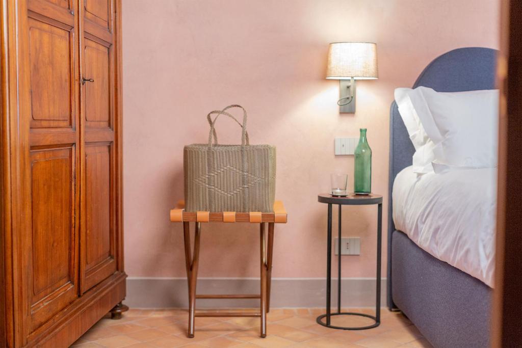Łóżko lub łóżka w pokoju w obiekcie Locanda La Concia