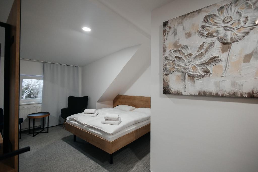 Postel nebo postele na pokoji v ubytování Golden Golem hotel & Spa