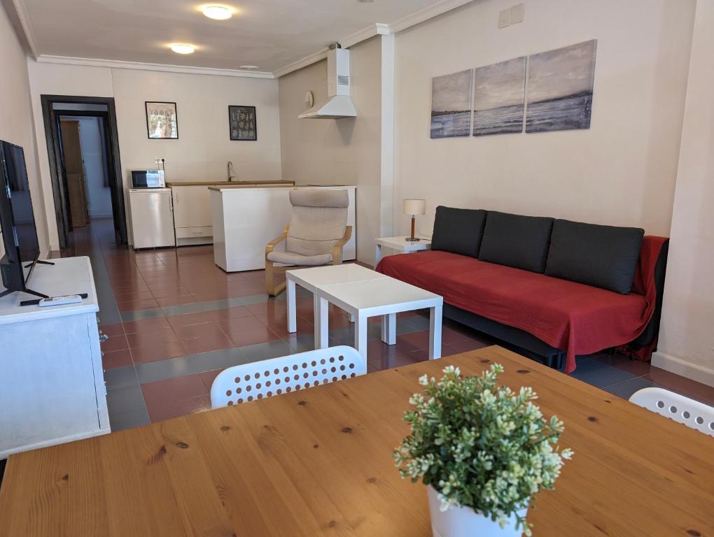a living room with a couch and a table at Apartamento Casa Balina in Dúrcal