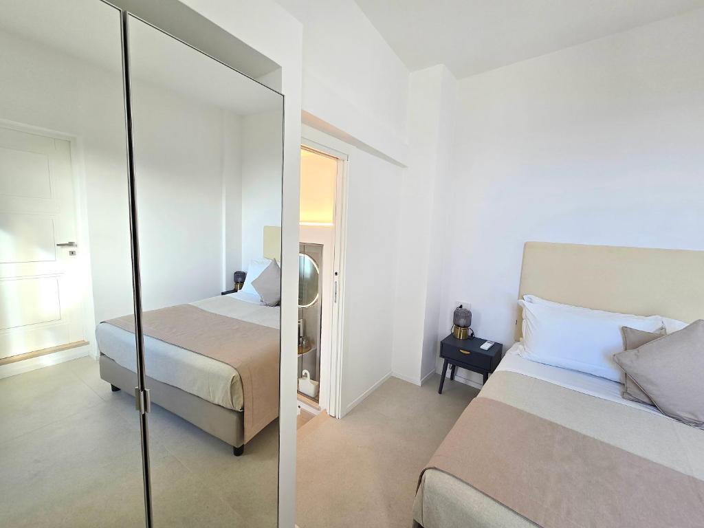 Postel nebo postele na pokoji v ubytování Sopramonte Exclusive Rooms