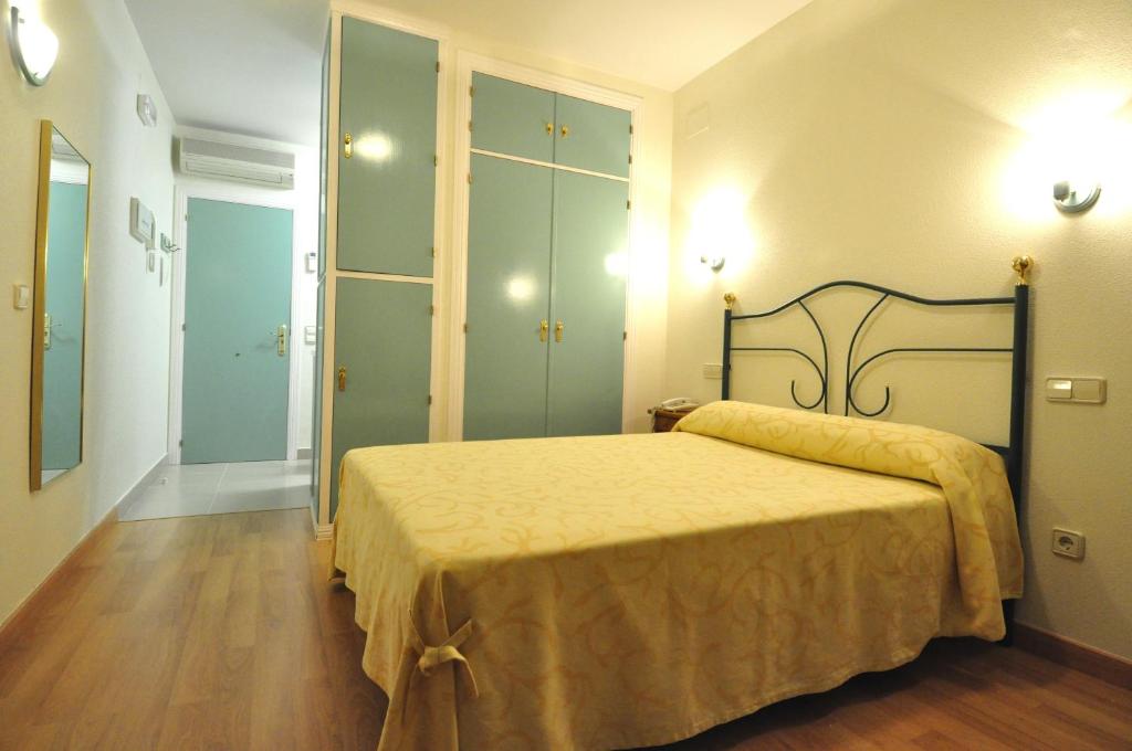 Postel nebo postele na pokoji v ubytování Hotel Apartamentos Aralso Sotillo