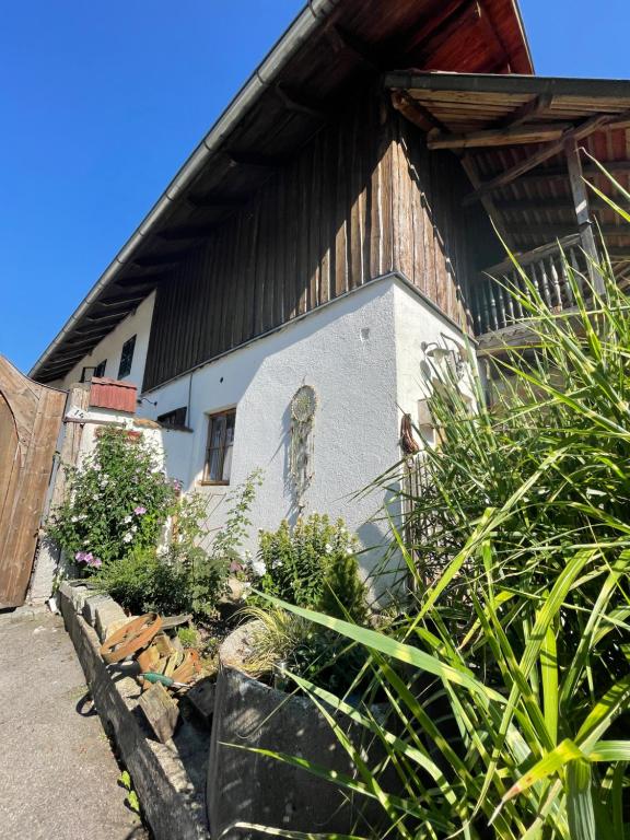 an old house with a garden in front of it at Landliebe in Vorchdorf