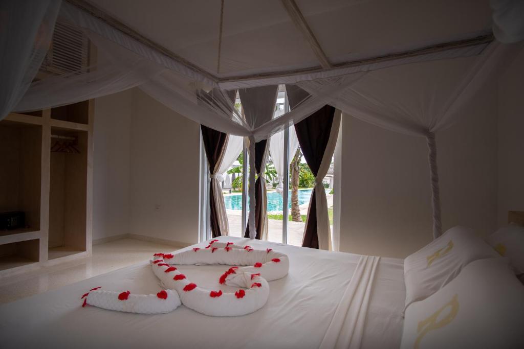 Voodi või voodid majutusasutuse Rafiki Tamu Residential Resort toas
