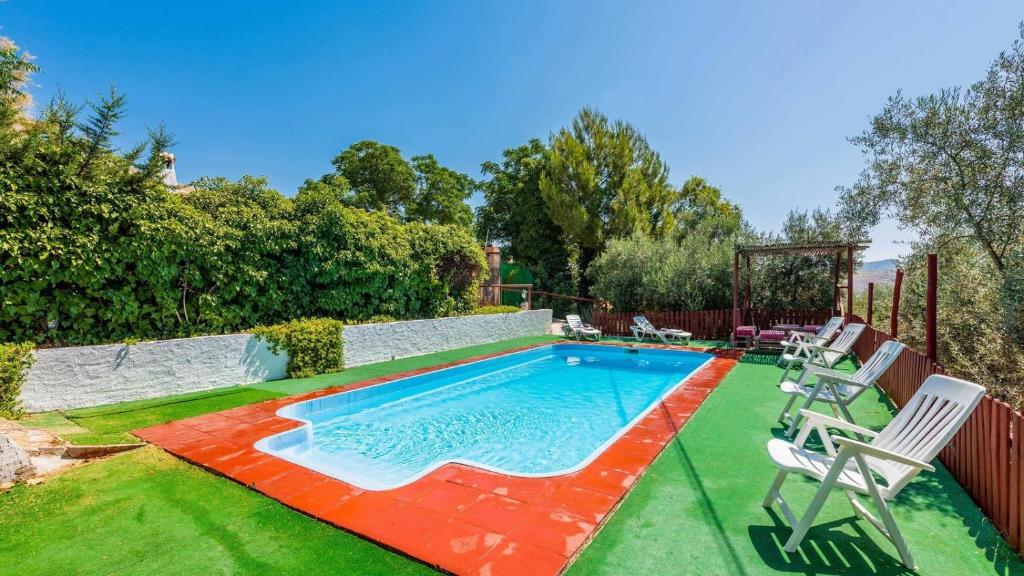 The swimming pool at or close to Molino Los Justos - Casa Vieja- Algarinejo by Ruralidays