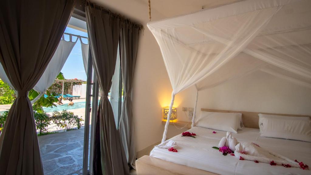 Voodi või voodid majutusasutuse Rafiki Tamu Residential Resort toas