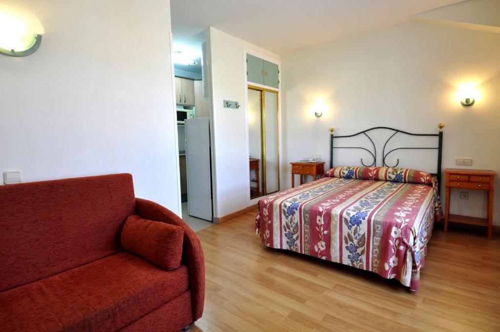 Postel nebo postele na pokoji v ubytování Hotel Apartamentos Aralso Sotillo