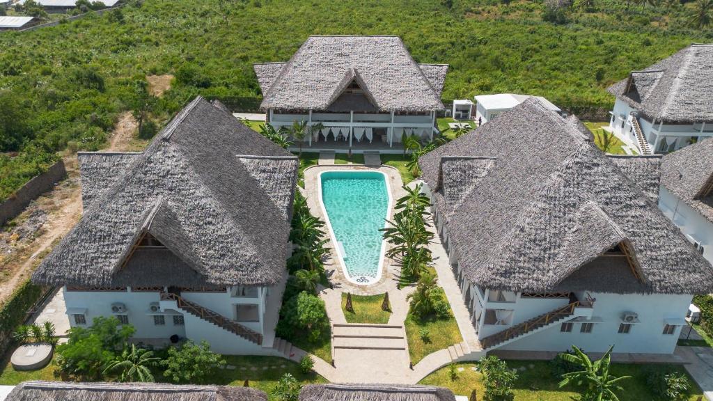 an aerial view of a house with a swimming pool at Rafiki Tamu Residential Resort in Watamu