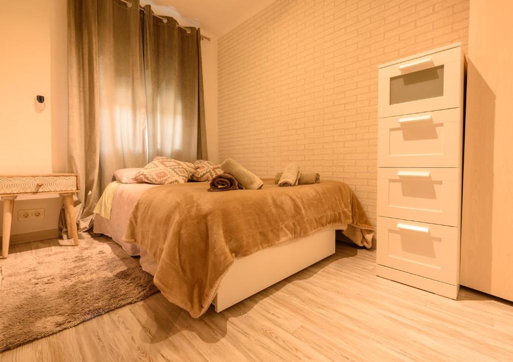 A bed or beds in a room at Apartamento Reisol