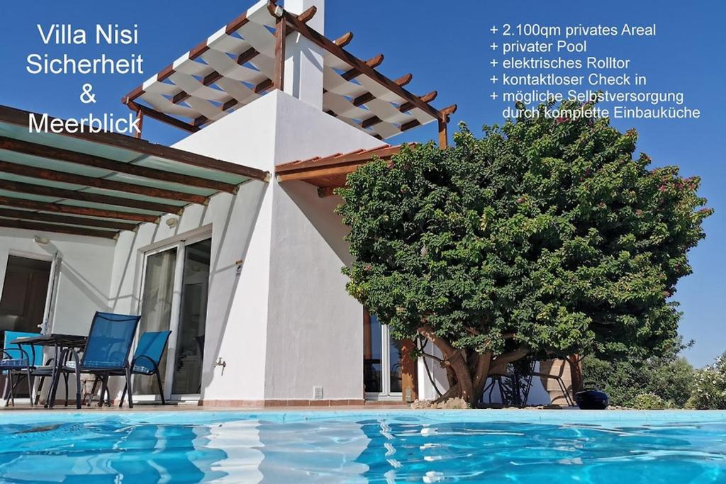 a magazine advert for a villa with a swimming pool at Villa Nisi in Agia Galini