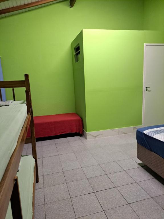 Postel nebo postele na pokoji v ubytování Girassol Hostel by Katita