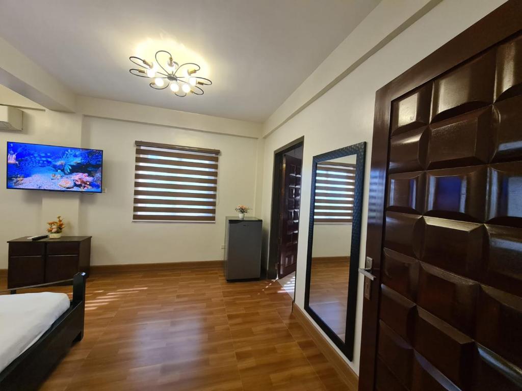 TV a/nebo společenská místnost v ubytování Azure Ocean View Villa
