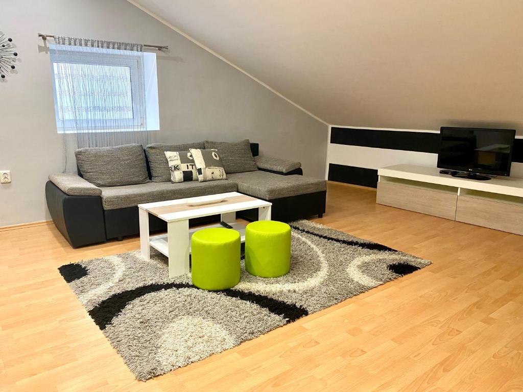 a living room with a couch and a table at Apartments Suzi Crikvenica in Crikvenica
