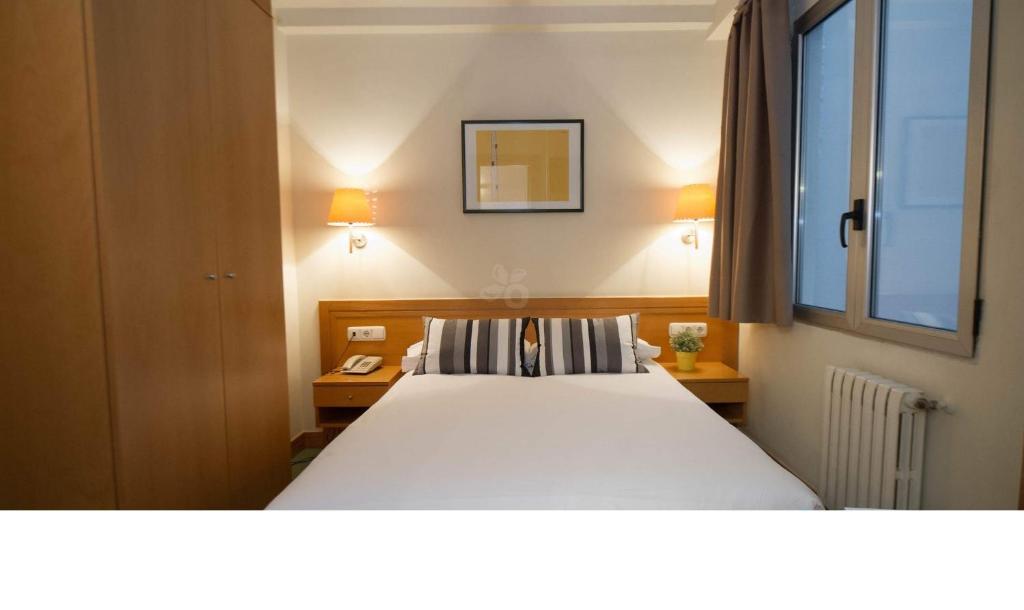 Posteľ alebo postele v izbe v ubytovaní Hotel Zaragoza Plaza