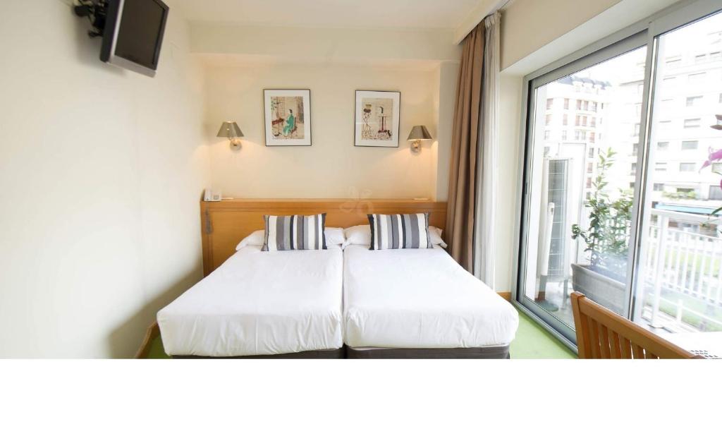 Posteľ alebo postele v izbe v ubytovaní Hotel Zaragoza Plaza