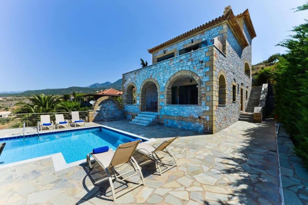 an image of a villa with a swimming pool at Luxury Villa Nefeli in Stoupa, Private Pool & BBQ in Neokhórion