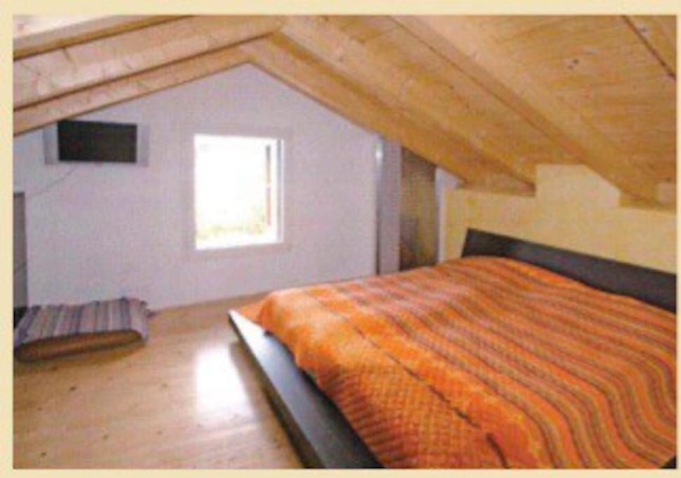 Postel nebo postele na pokoji v ubytování Rustico sopra Brissago