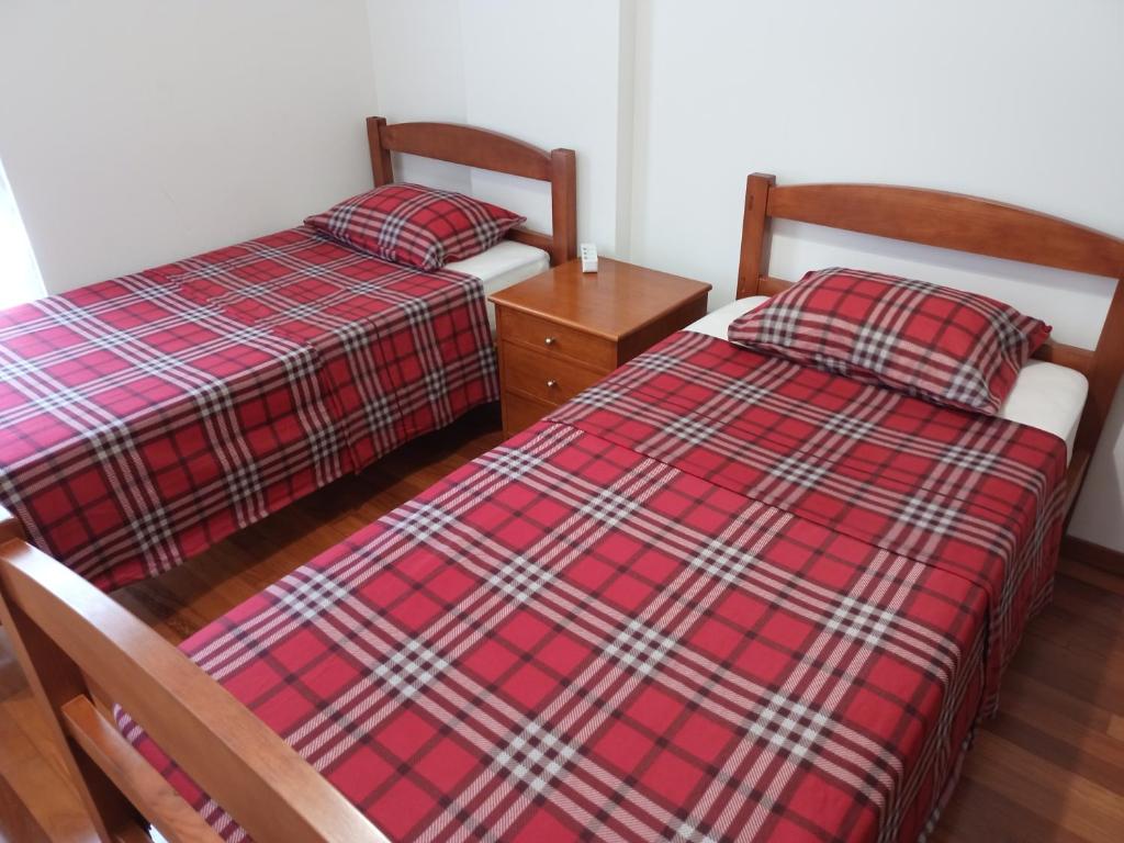 Кровать или кровати в номере Costa Lodge Madeira, pick up - drop off, car and motorcycle rentals