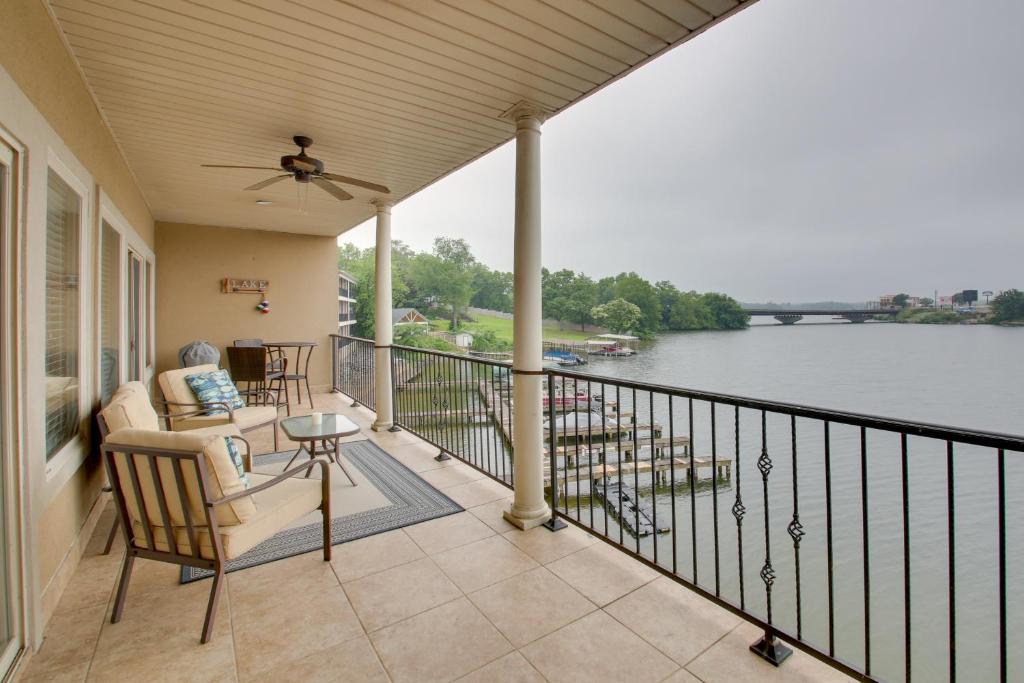 a balcony with chairs and a view of a river at Hot Springs Condo on Lake Hamilton with Pool Access in Hot Springs
