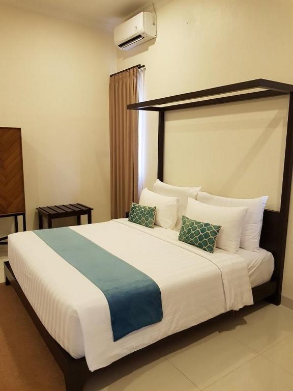 Postel nebo postele na pokoji v ubytování New Belitung Holiday Resort